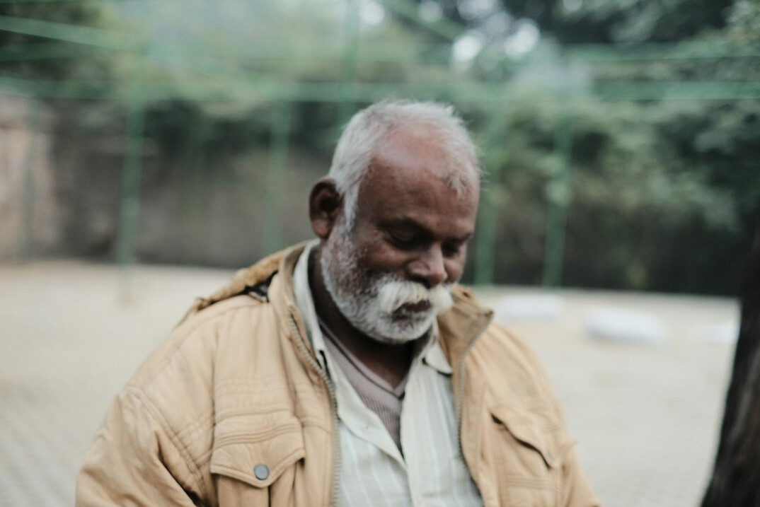 Portrait of a smiling mature man with a grey beard